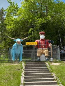 A picture of the giant sized statues of Paul Bunyan and his ox, Blue at Castle Rock tourist destination the Upper Peninsula of Michigan.
